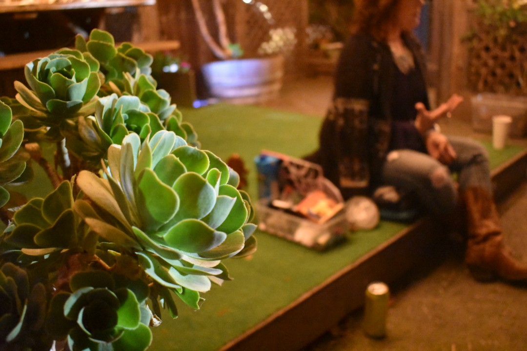 Tonkin uses items like crystals, figures of the divine feminine, candles, and tarot cards to channel energy for her ceremony and its attendees. She began the evening with a guided meditation to find a sense of being grounded.